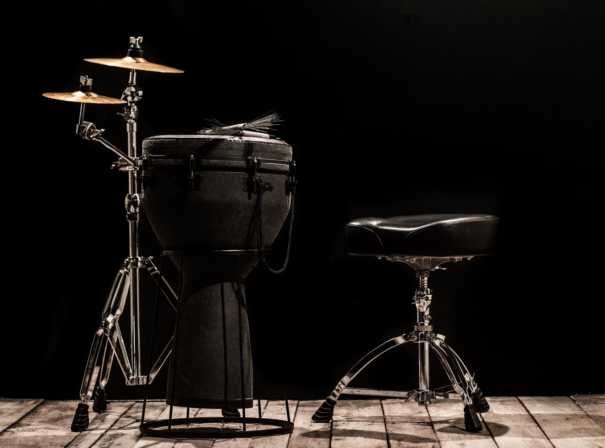 musical percussion instruments on black background